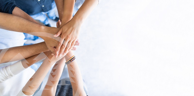 hands piled together | what makes Cedar different