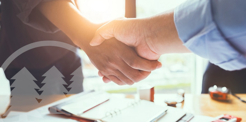 man shaking hands over a table with documents man shaking hands over a table with documents | select an hoa management company