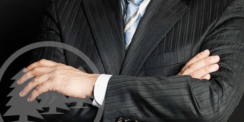 man in suit with his hands arms crossed | duties of an HOA president
