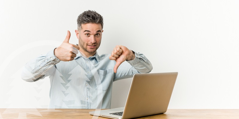 man in front of laptop doing thumbs up and thumbs down signs man in front of laptop doing thumbs up and thumbs down signs | evaluate your HOA manager
