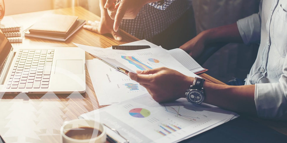 people discussing about accounting with laptop and coffee on the table people discussing about accounting with laptop and coffee on the table | best accounting method for HOA