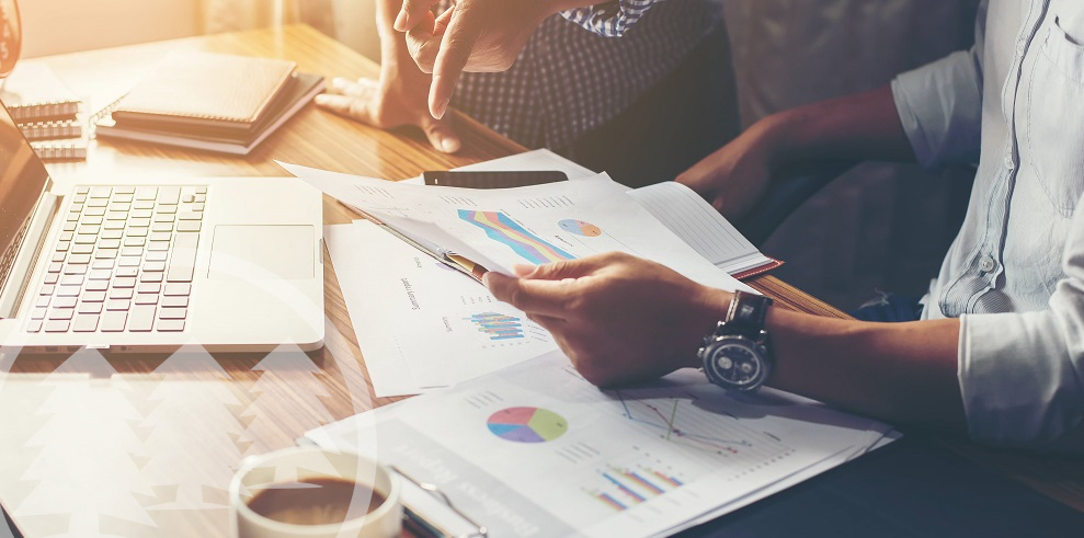 people discussing about accounting with laptop and coffee on the table people discussing about accounting with laptop and coffee on the table | best accounting method for HOA