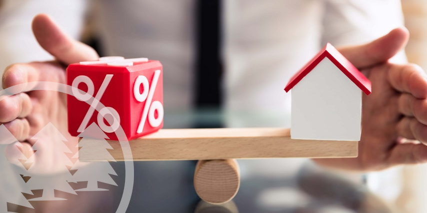 man balancing percentage dice and house model | hoa loans