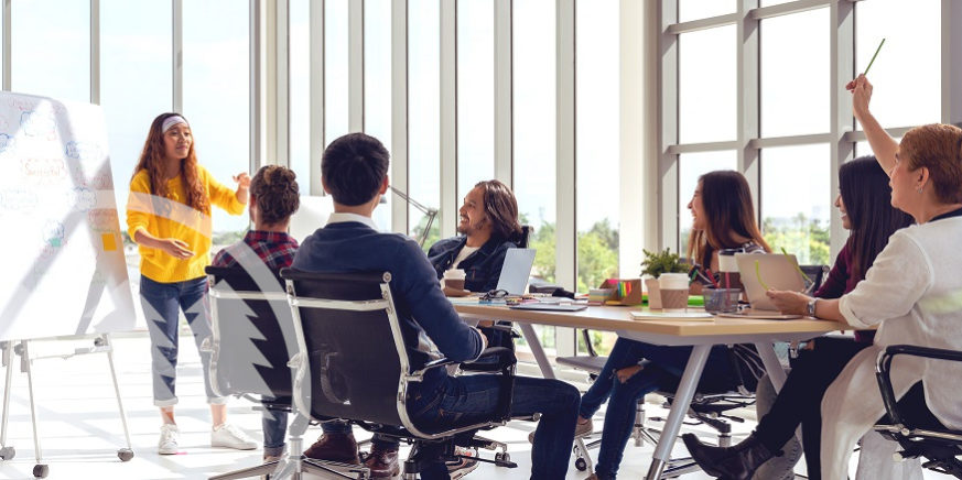 a group of people in a meeting | hoa board meetings