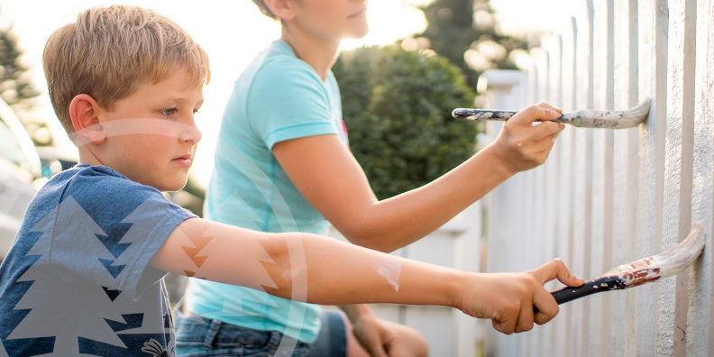 boy and woman painting fence | summer projects for HOA