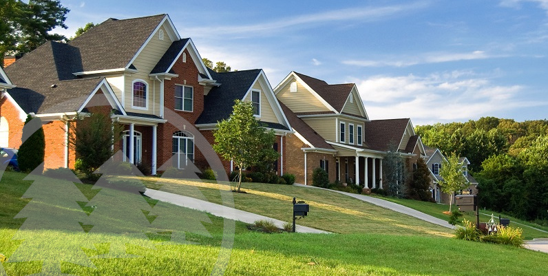 houses with green lawns in front with blue sky background | community curb appeal