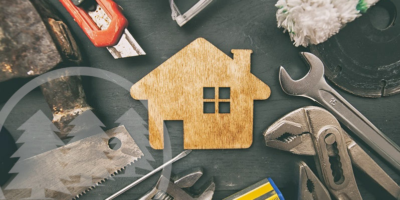 repair tools with wooden house model in the middle | what are capital improvements