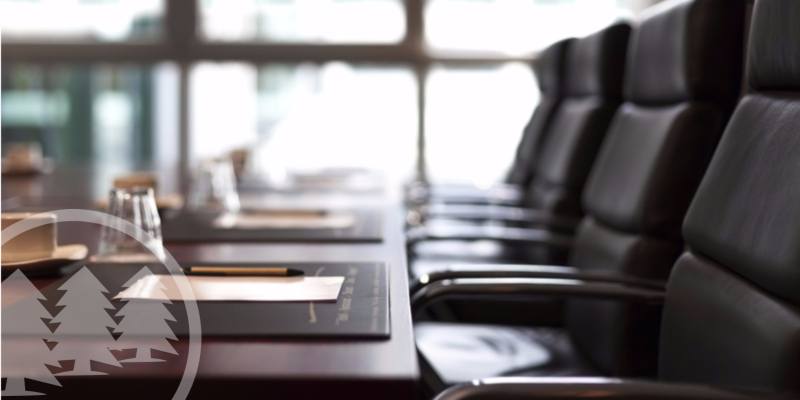 board meeting conference room with pen and paper on the table | hoa annual meeting