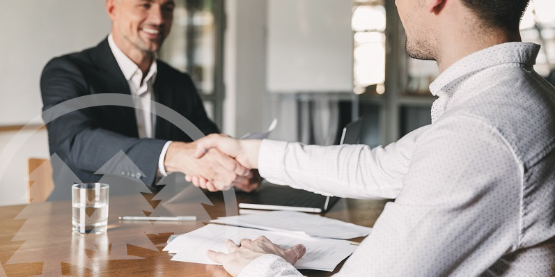 man smiling and handshaking with another man man smiling and handshaking with another man | hiring an HOA management company