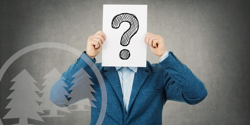 man covering his face using a white paper with drawn question mark man covering his face using a white paper with drawn question mark | questions to ask an hoa management company
