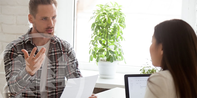 man complaining to a woman using laptop man complaining to a woman using laptop | handle hoa complaints