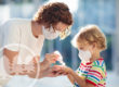 A mother and child protecting themselves from germs and viruses | Coronavirus HOA Community Guidelines