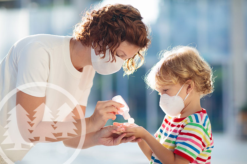 A mother and child protecting themselves from germs and viruses | Coronavirus HOA Community Guidelines