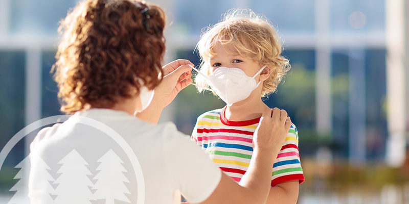 Woman protecting her child by using face mask Woman protecting her child by using a face mask | hoa board members and covid-19